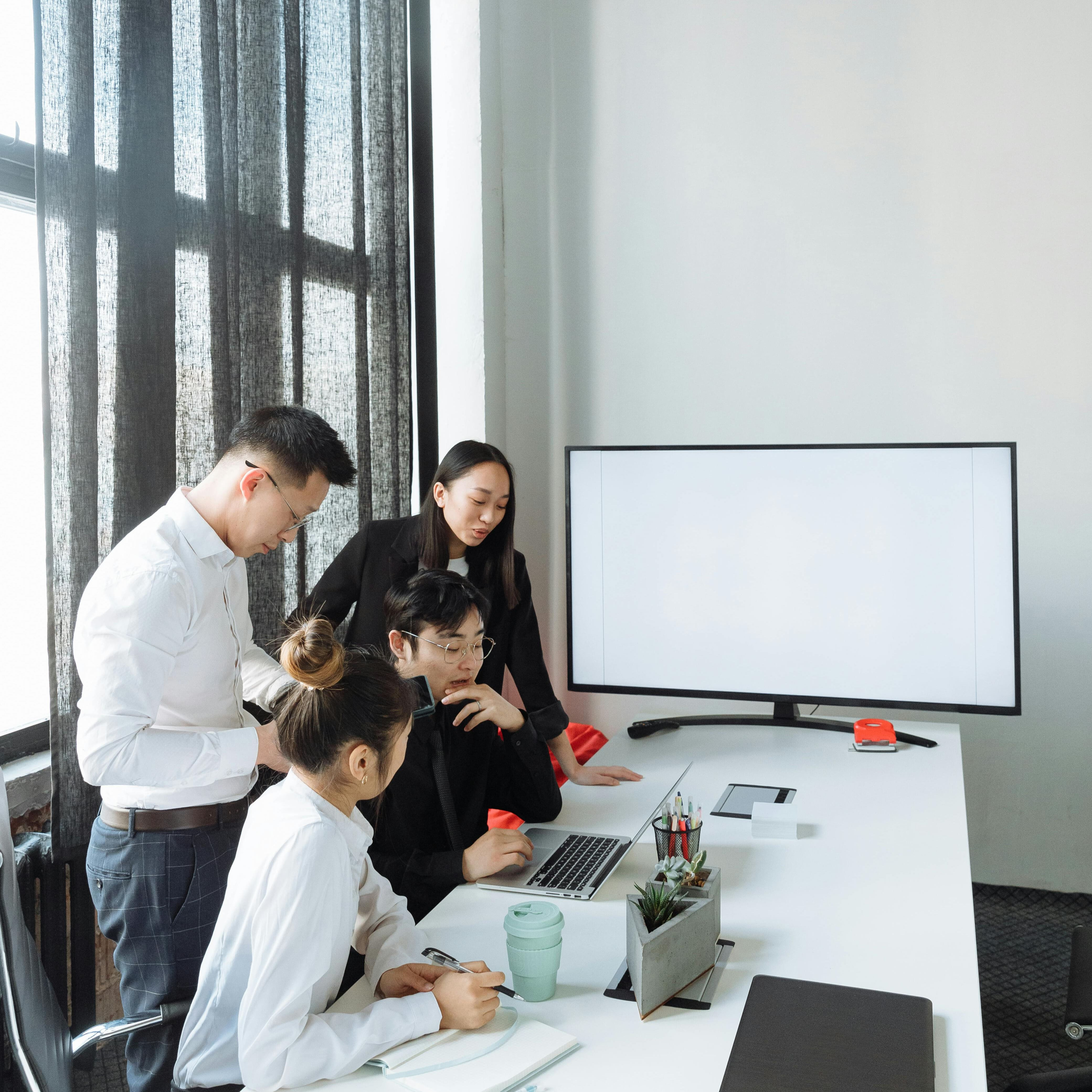people looking at a computer